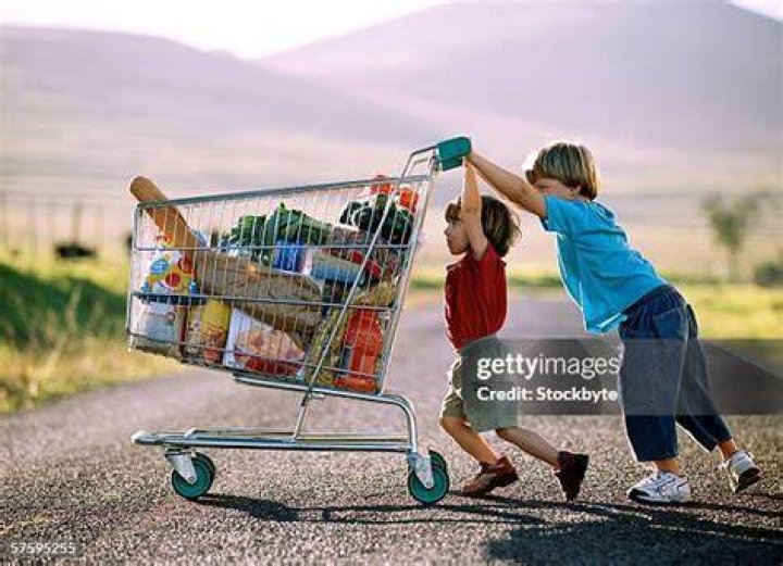 young boy pushing cart full of harvest for Erntedankfest