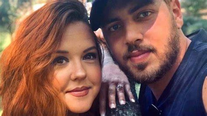 Zied Hakimi and Rebecca Parrott from 90 Day Fiance smiling outside